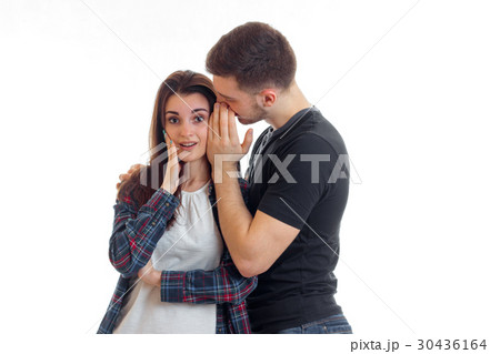 Guy something whispers in the ear of a young girl 30436164