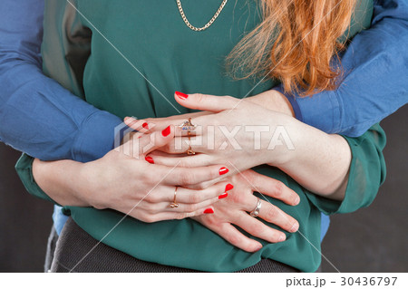 Caucasian couple embrace one another closeup Caucasian couple embrace one another closeup 30436797