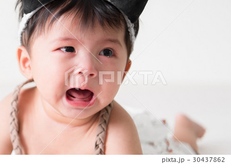 Crying Asian girl 6 months old. 30437862