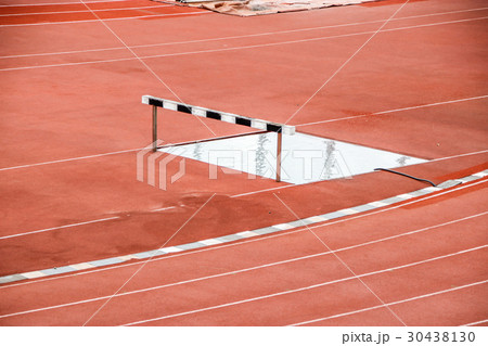 Outdoor red running track in stadium. Outdoor red running track in stadium. 30438130