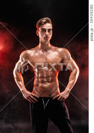 Strong bodybuilder man with perfect abs, shoulders 30439280