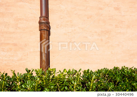 Weathered brick wall with pipe gutter. Detail of Weathered brick wall with pipe gutter. Detail of 30440496