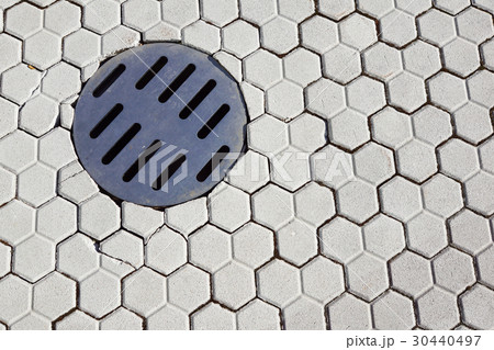 Steam coming out of manhole in a street . 30440497