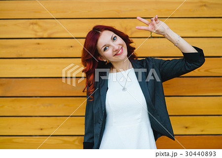 Girl show the peace sign and smiling Girl show the peace sign and smiling 30440893