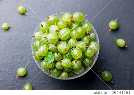 Fresh gooseberries in glass bowl. Top view. 30441561
