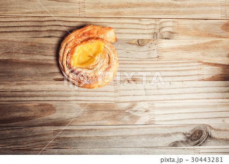 Danish on a rustic wooden table Danish on a rustic wooden table 30443281