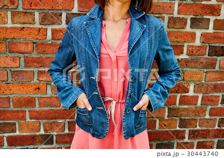 style. Girl in pink dress and denim jacket on style. Girl in pink dress and denim jacket on 30443740