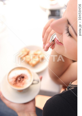 Portrait of a brunette woman during the coffee break 30450456