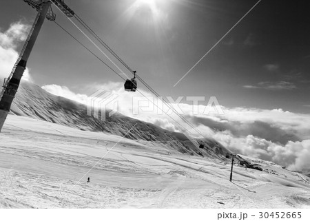 Black and white view on gondola lift and ski slope 30452665