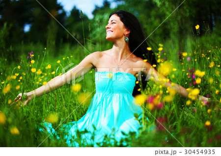woman on summer flower field 30454935