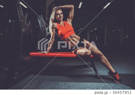 Fitness sexy mode on diet with long female legs gym. 30457952