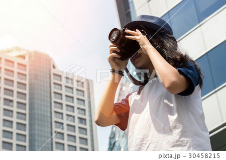 asian girl take photo in city 30458215