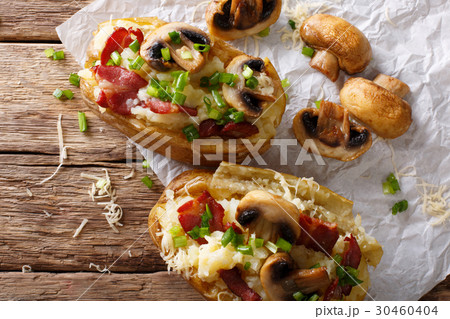 Slowly baked potatoes with bacon, mushrooms Slowly baked potatoes with bacon, mushrooms 30460404