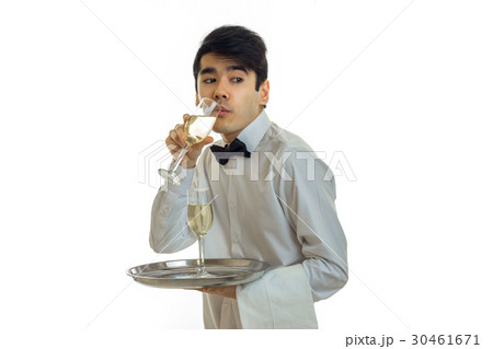 a young waiter in a white shirt with a butterfly 30461671