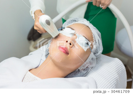 Beautician Giving Laser Treatment On Face. 30461709