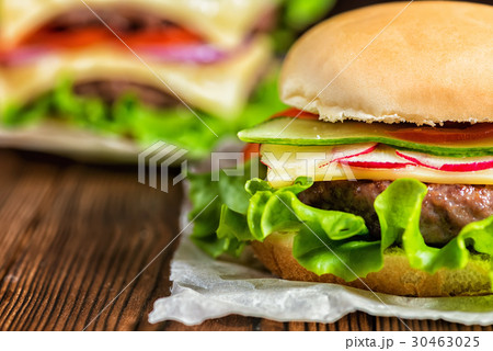 close up of fresh home made hamburgers with beef close up of fresh home made hamburgers with beef 30463025