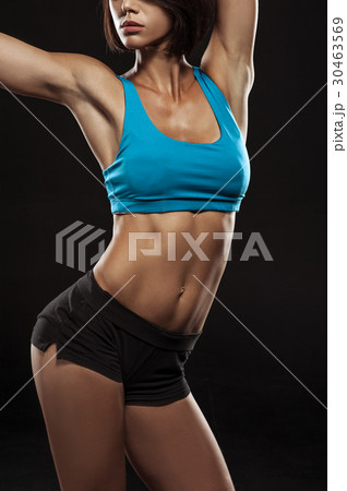 Young woman athlet muscle body portrait in gym 30463569