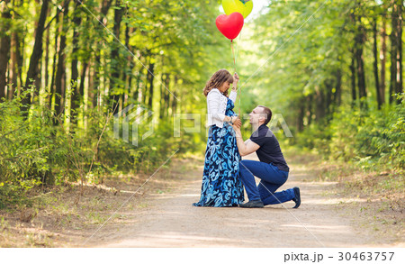 Caucasian pregnant woman and her husband outdoors 30463757
