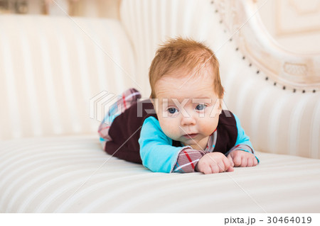 Close-up portrait of baby boy with red hair and 30464019