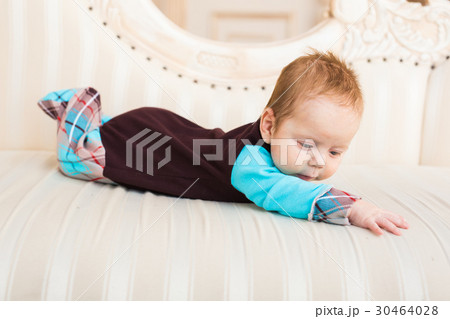 Adorable baby boy with red hair and blue eyes Adorable baby boy with red hair and blue eyes 30464028