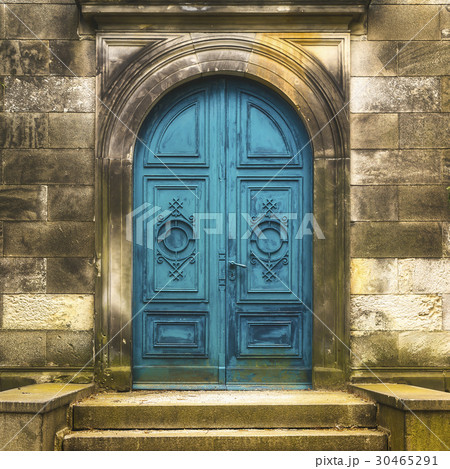 old turquoise metal gate of an old tomb 30465291