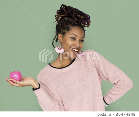 African Woman Holding Pink Apple with a Smile African Woman Holding Pink Apple with a Smile 30474849