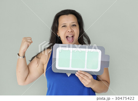 A powerful woman holding full charging battery 30475422