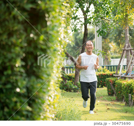 Blurry Picture of Adult Man Running in the Park 30475690