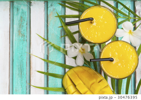 Mango smoothie, juice and fresh mango. Top view. 30476395