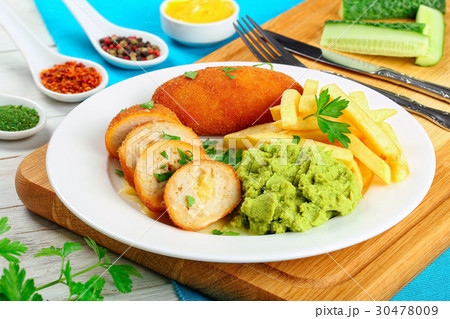 chicken cutlets filled with butter and cheese 30478009