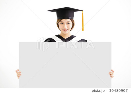 Graduate student girl showing blank placard board Graduate student girl showing blank placard board 30480907
