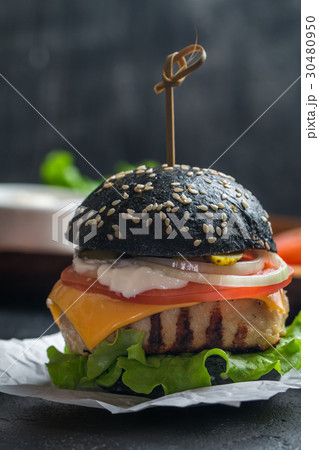 black burger with grilled chicken patty  30480950
