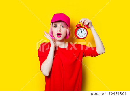 young woman with alarm clock 30481301