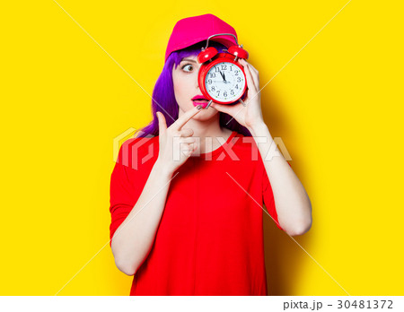 young woman with alarm clock 30481372