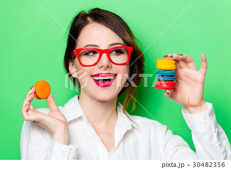 young woman with macaroons young woman with macaroons 30482356