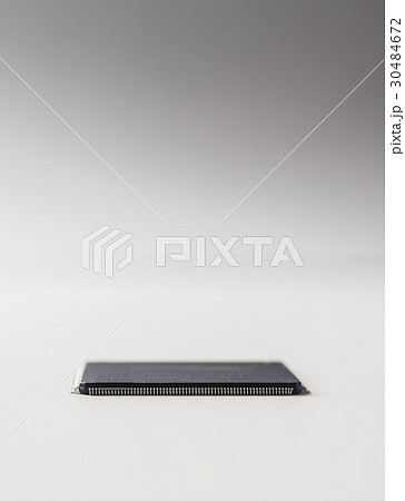 semiconductor IC chip isolated on grey background semiconductor IC chip isolated on grey background 30484672