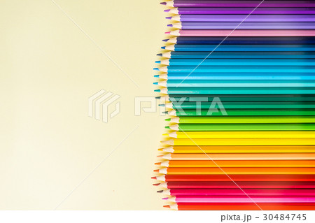 Top view of color pencil circle on yellow paper Top view of color pencil circle on yellow paper 30484745