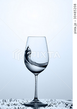 Splashing transparent water wave in the wine glass 30485208