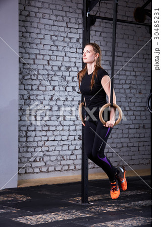 Young attractive woman doing cross fit push ups Young attractive woman doing cross fit push ups 30485231