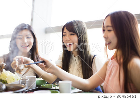 happy young Women group  Eating hot pot 30485461