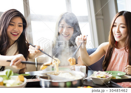 happy young Women group  Eating hot pot 30485462