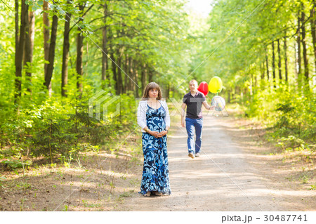 Caucasian pregnant woman and her husband outdoors 30487741