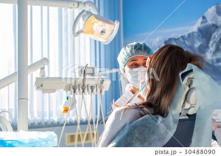 Woman dentist in the medical dental office. She is 30488090
