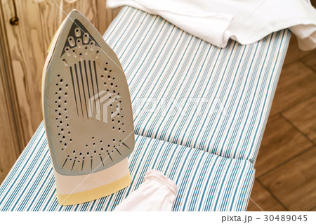 Close-up of female hand ironing Close-up of female hand ironing 30489045