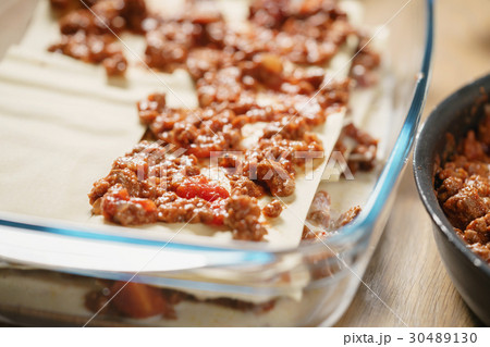 preparing lasagna process on home kitchen for 30489130
