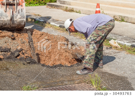 Plumbing Repair Man and excavator scoop Plumbing Repair Man and excavator scoop 30493763