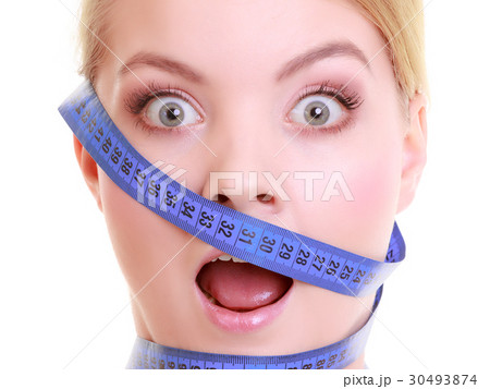 Obsessed girl with violet measure tapes around her head Obsessed girl with violet measure tapes around her head 30493874