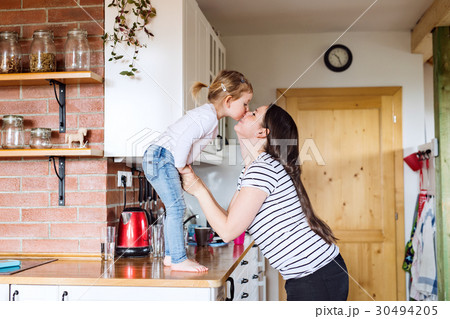 Beautiful young mother and her cute little 30494205