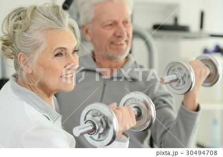 Beautiful elderly couple in a gym Beautiful elderly couple in a gym 30494708
