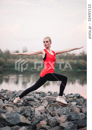 Young girl doing yoga fitness exercise outdoor Young girl doing yoga fitness exercise outdoor 30495510